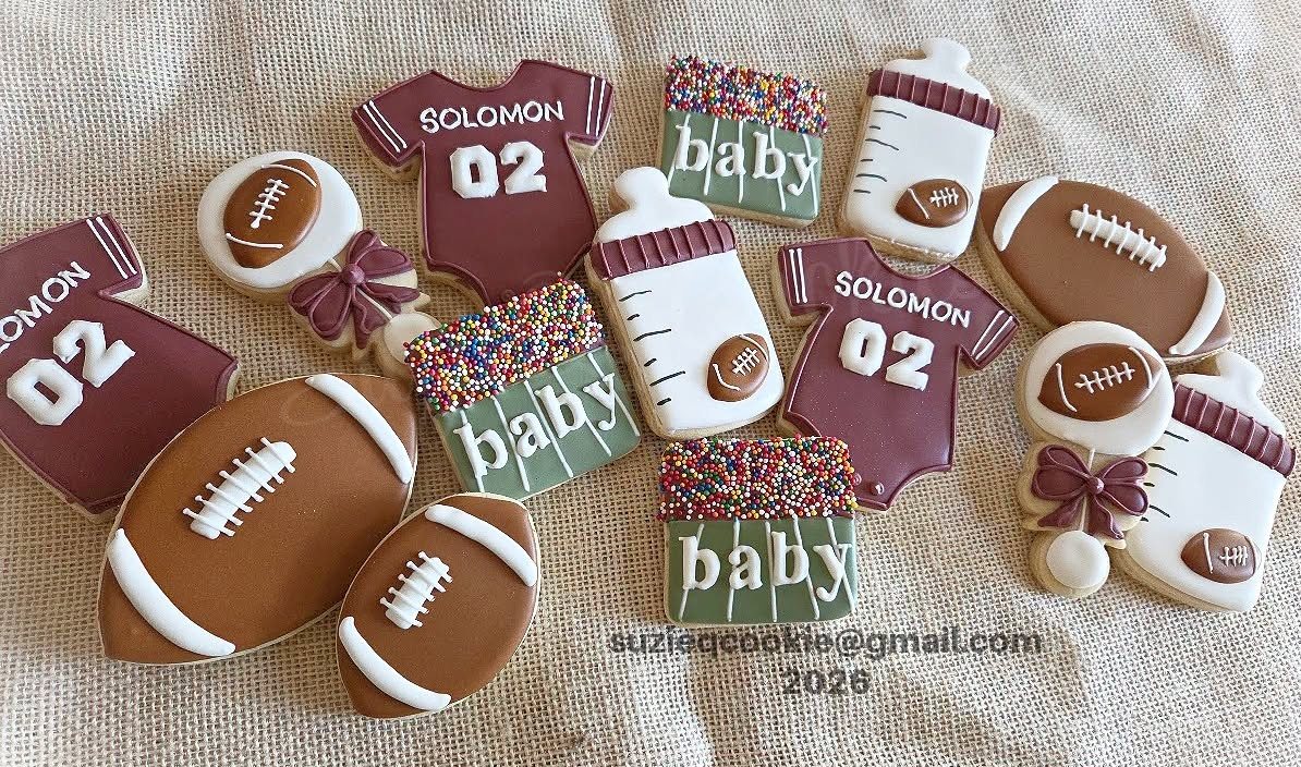 Maroon football baby shower cookies with jerseys, bottles and rattles
